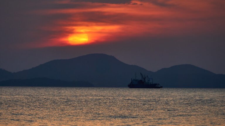 Red sunset over Pattaya from Pratumnak Hill — sea view condominiums