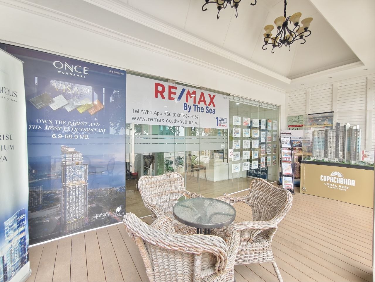 Outdoor consultation seating and listing displays at RE/MAX By The Sea